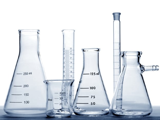 Conical glass Erlenmeyer flasks flanked by a beaker by Poughkeepsie Day School via Flikr.