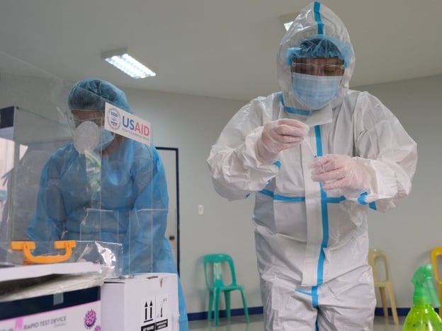 COVID testing procedures taking place in the Philippines by USAID US Agency for International Development via Flikr.