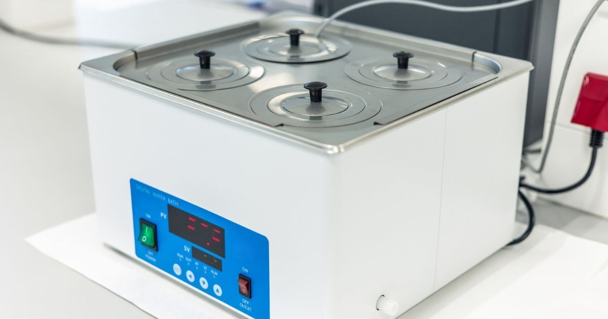 Laboratory water bath heating samples in a scientific lab.