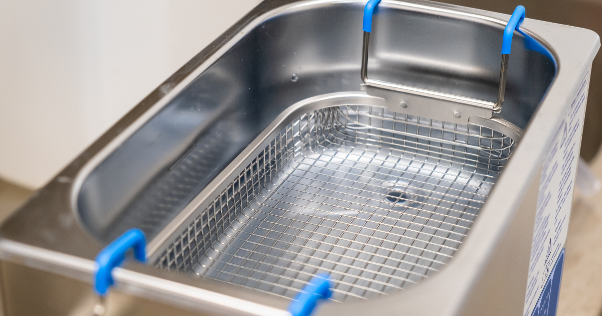 An empty ultrasonic cleaner in a lab.
