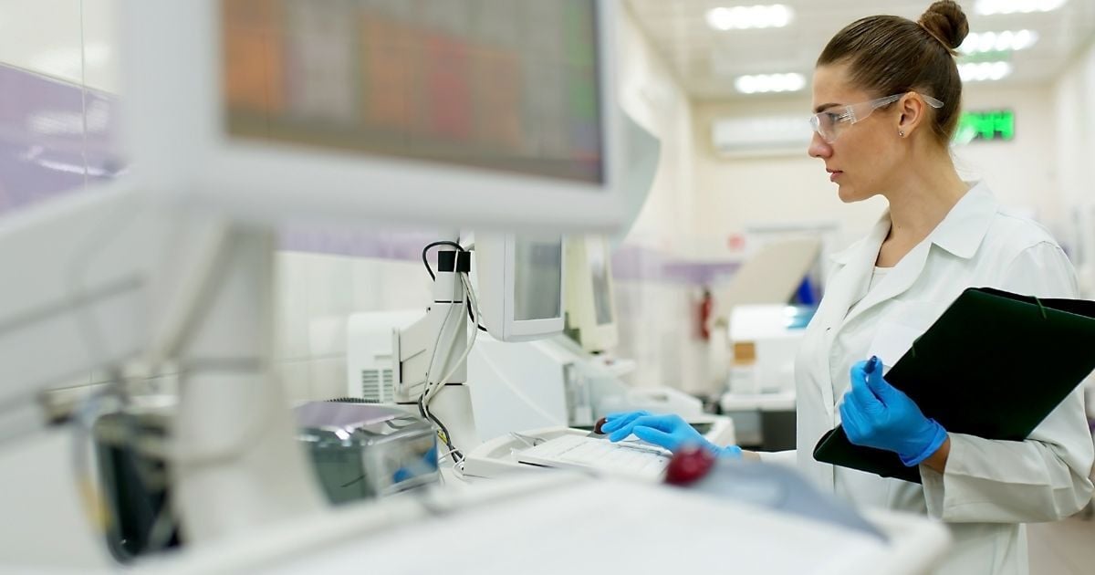 A scientist checks for drift on lab equipment.