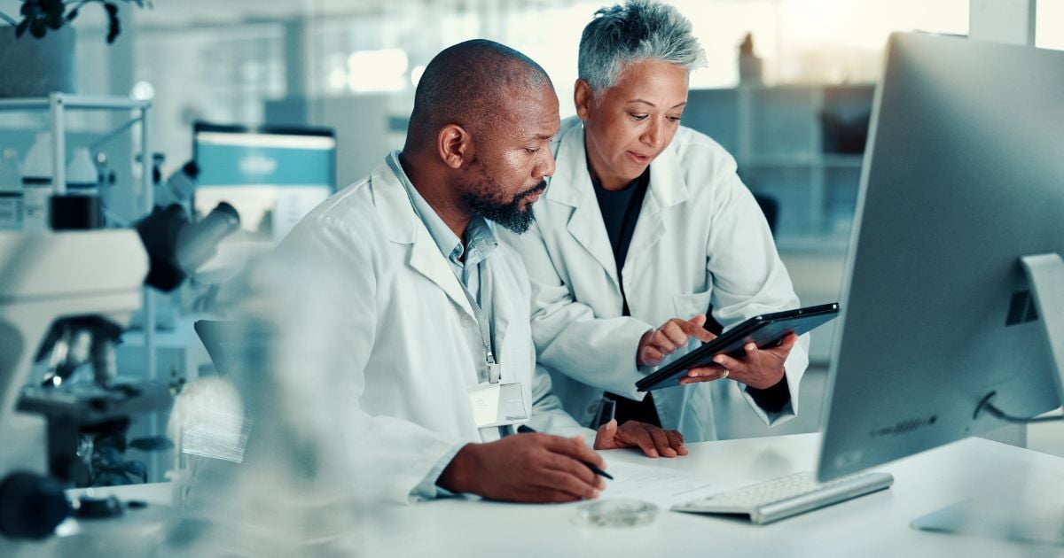 Two scientist evaluting lab equipment for moving from bench to pilot scale.