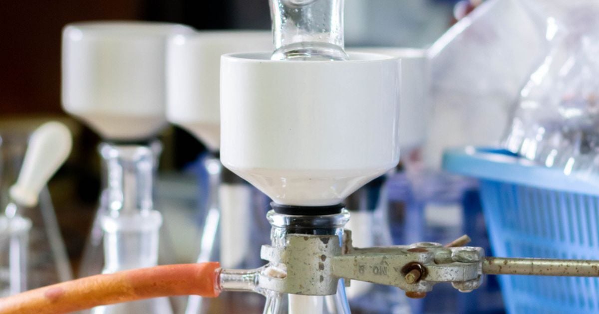 A buchner funnel being used for filtration in a lab.