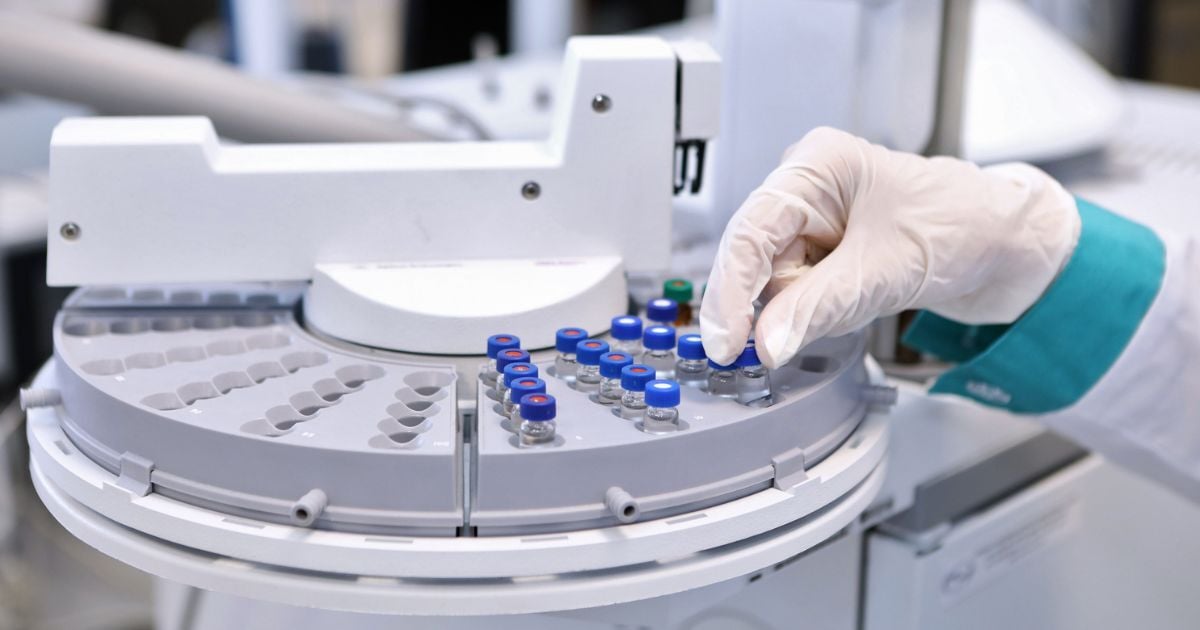 A person uses speciality lab equipment to prepare for CLIA oversight.