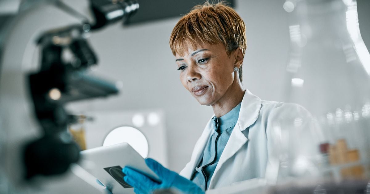 A scientist reviewing information on the lab's benchtop lab equipment.