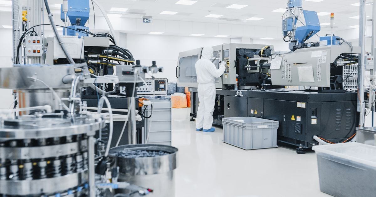 A scientist in a lab working on different equipment.